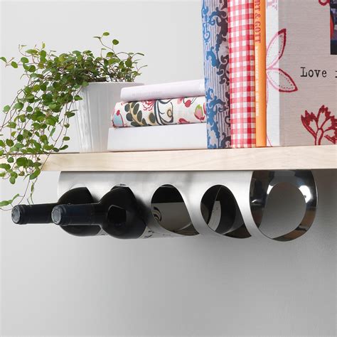 Stainless Steel wall hanging wine bottle rack which makes an excellent rolling pin rack. . Ikea wine racks